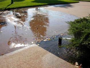 leaking pop up head requires immediate sprinkler repair in North Highlands CA